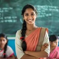 ai-generated-portrait-of-a-smiling-indian-female-teacher-standing-with-arms-crossed-in-classroom-photo